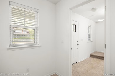 Front door opens up into a bright foyer