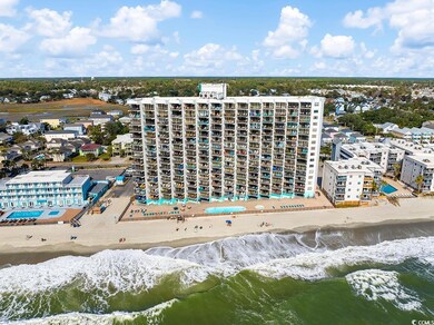 Drone / aerial view with a water view and a beach 