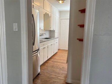 Adorable, vintage kitchen with large, stainless re