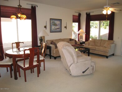 Living room has open dining area