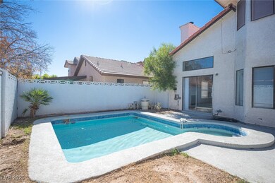 View of swimming pool with a fenced backyard and a patio