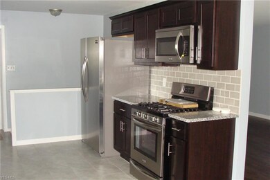 New stainless steel refrigerator, stove and microw