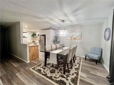 Dining room featuring light wood-style floors and recessed lighting