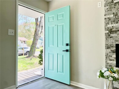 Doorway to outside with a healthy amount of sunlig