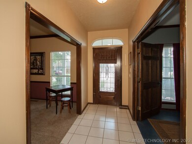 Front entryway with formal living room on one side