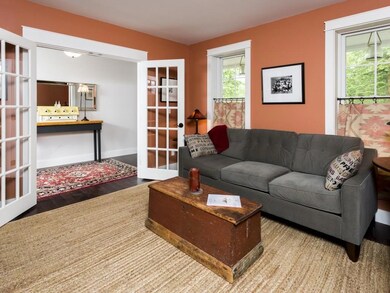 The den with wood flooring