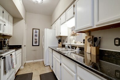 Tons of cabinet and counter space in this bright k