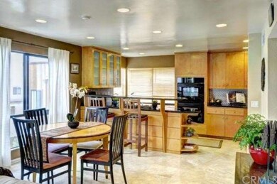 Travertine floors throughout kitchen, dining area 