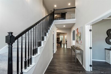 Welcoming entry way with sweeping ceiling, new lig