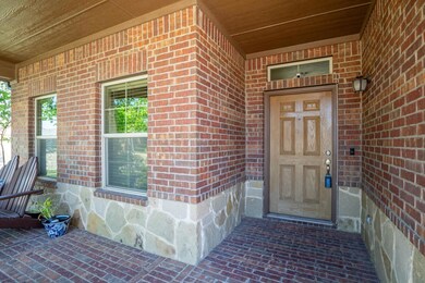 Entrance to property featuring a porch