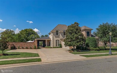 French country style house with a front yard
