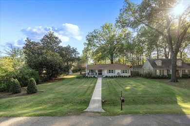 View of front of property featuring a front lawn a