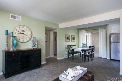 Living room opens to the dining room for a spaciou