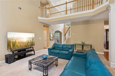 Open floor plan with 2-story family room provides 