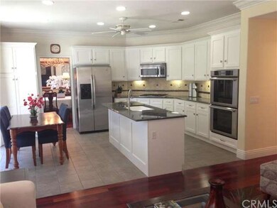 Updated ktichen with white shaker style cabinetry,