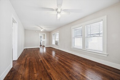 Large living and dining room combo with neutral pa