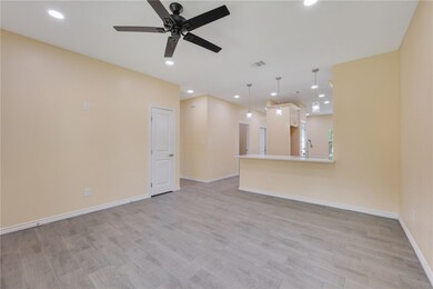 Unfurnished living room featuring light wood-style