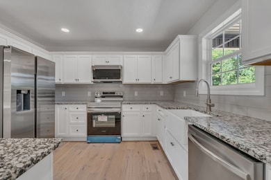 **Reference photo from a previous build - tops to be black leathered granite**