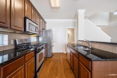 Kitchen featuring stainless steel appliances, a s