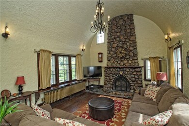 Living room with vaulted arched ceiling and beauti