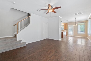 Unfurnished living room with ceiling fan, crown m