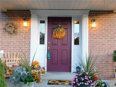 The covered front porch provides dry and cozy gree