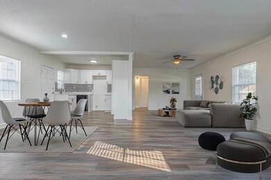 Living area with a textured ceiling, wood finished