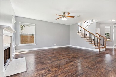 Spacious den boasting a gas fireplace.
