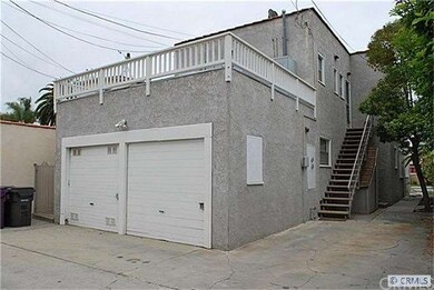Two garages, extra parking and a deck off the upst