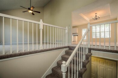 Family room to the left with new carpet.