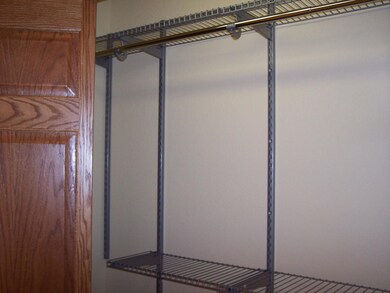 bedroom closet with built in shelves<|><