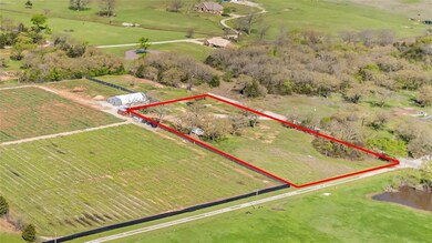 Birds eye view of property with a rural view