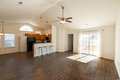 Unfurnished living room featuring high vaulted cei