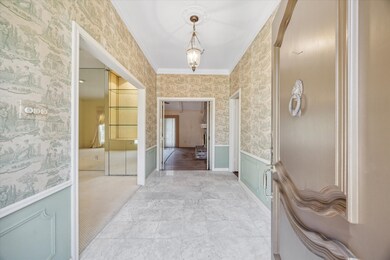 An entry filled with natural light, soaring 9' cei