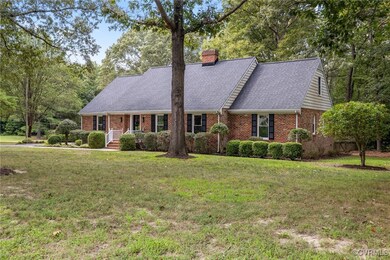 Cape cod-style house with a front yard