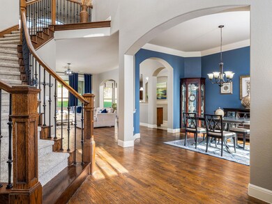 Entrance foyer featuring arched walkways, stairwa