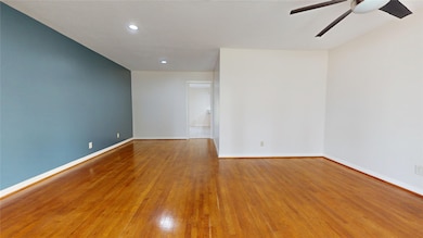 Bright living room featuring warm hardwood floors