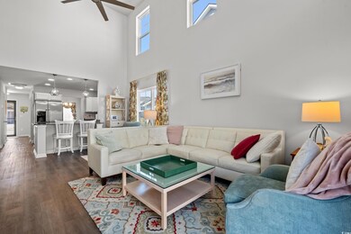 Living room featuring baseboards, dark wood-type f