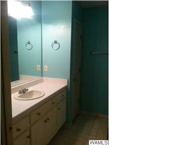 Master bath features large vanity , shower tub com