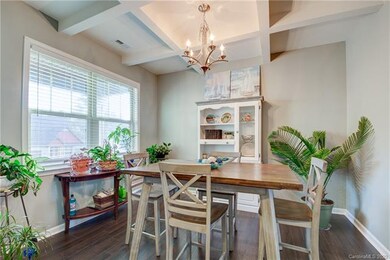 Light, bright dining room with coffered ceiling.