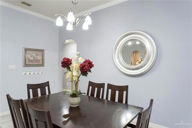 Dining area is off the main kitchen or this can be additional living area.  Hall to the right houses 2 bedrooms and a shared bath plus laundry and access to garage.