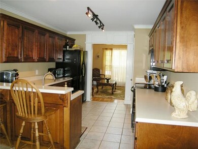 Kitchen has tile flooring.