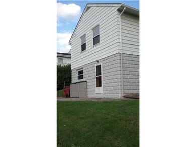 Exterior Back. Patio area off of kitchen door