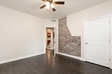 Main Floor Bedroom  with exposed Brick