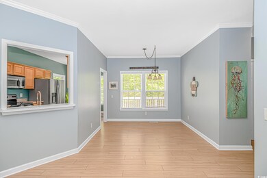 Unfurnished dining area featuring baseboards, orna