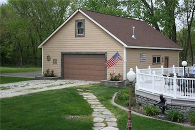 Oversized detached heated garage with clubhouse up