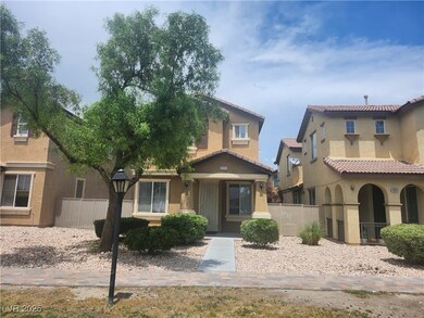 View of front of property featuring a tile roof an