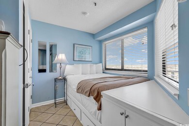 Bedroom featuring a textured ceiling and light til