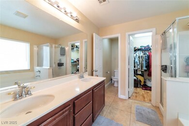 Full bath with a sink, visible vents, a shower sta