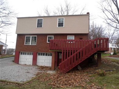 Exterior Back. NEWER WINDOWS THROUGHOUT!
